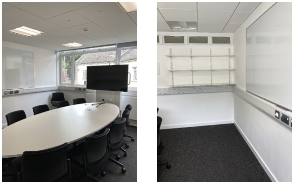 Collaboration Table with Chairs in center of room.